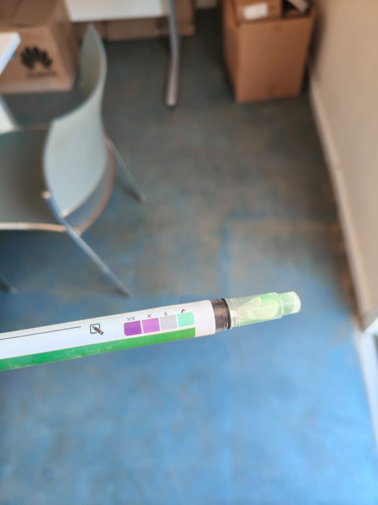 Air sampling tube held indoors during a mould survey